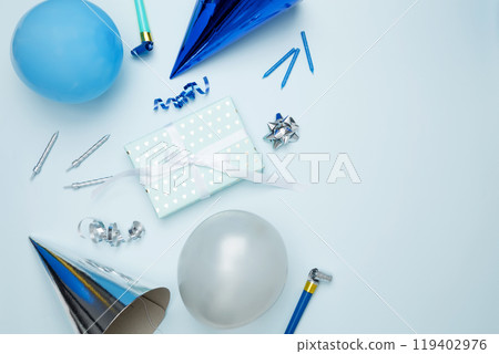 Birthday attributes colorful balloons, party hats, candles, and confetti. Concept of festive birthday celebrations 119402976