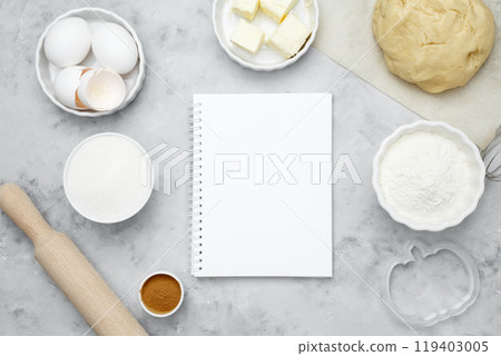 Ingredients for baking cookies for Halloween, notepad mock-up for writing down the recipe. Seasonal autumn baking Ingredients for baking cookies for Halloween, notepad mock-up for writing down the recipe. Seasonal autumn baking 119403005