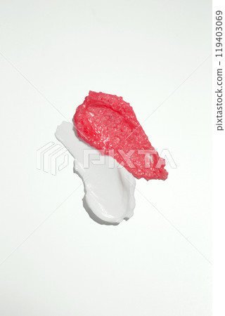 Smears of body scrub and moisturising cream on white background. Body scrub texture of the swatch. Cosmetic smear Smears of body scrub and moisturising cream on white background. Body scrub texture of the swatch. Cosmetic smear 119403069