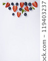 white background with berries and mint, a template for inserting text, copy space. High quality photo 119403237