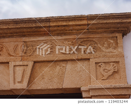 travel to city of Lindos on island of Rhodes, Greece. Details of streets of old town Lindos. Interesting elements of door, shutters, bas-relief of walls. tourist attraction on island of Rhodes 119403244