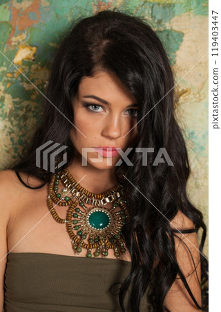 Posing fashion model woman with healthy long hairstyle and trendy make-up.  119403447