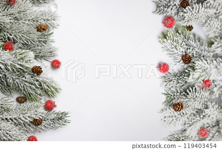 Christmas composition flatlay. Green spruce branches with snow and red berries on white background 119403454