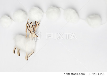 White Christmas decoration reindeer on white card background border with copy space 119403458