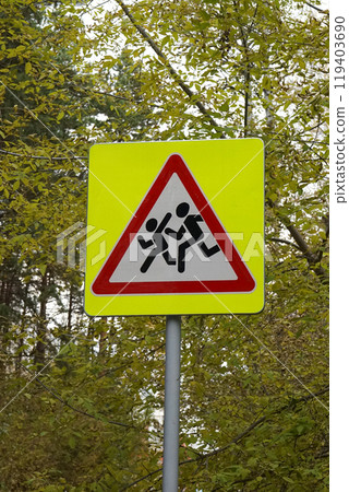 Road sign, installed near schools. Be careful, children. image of running people Road sign, installed near schools. Be careful, children. image of running people 119403690