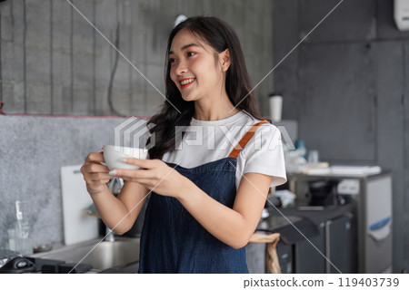 Young Barista Skillfully Preparing Coffee in a Modern cafe Setting with Professional Equipment and a Warm Smile 119403739