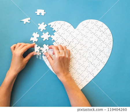 White puzzle in heart shape 119404260
