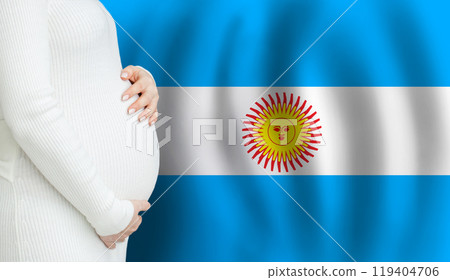 Pregnant woman belly against Argentine flag background. Demographics and pregnancy  119404706