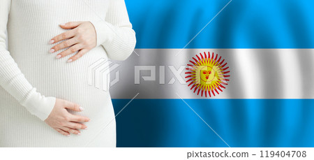 Argentine Pregnant woman belly against Argentine flag background. Argentine Pregnant woman belly against Argentine flag background. 119404708
