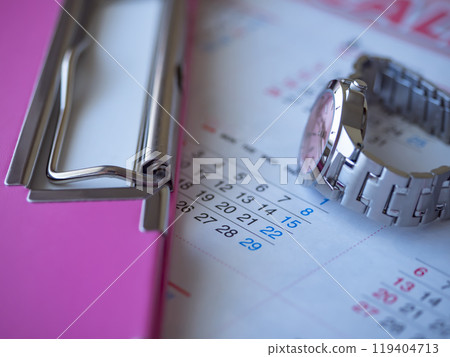 Binder, calendar and watch on a table Binder, calendar and watch on a table 119404713
