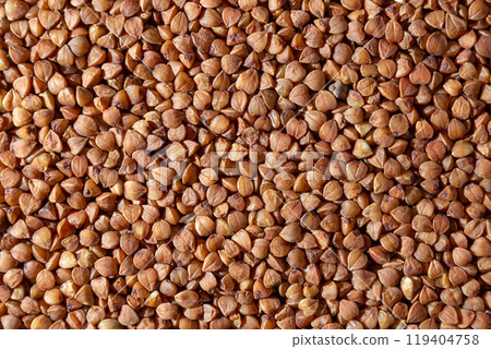 Dry Uncooked Brown Buckwheat Groats Background Dry Uncooked Brown Buckwheat Groats Background 119404758