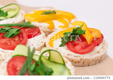 Vegan Rice Cake Sandwiches with Fresh Tomato, Yellow Paprika and Greens Vegan Rice Cake Sandwiches with Fresh Tomato, Yellow Paprika and Greens 119404773