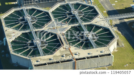 Aerial view of water treatment factory at city wastewater cleaning facility. Purification process of removing undesirable chemicals, suspended solids and gases from contaminated liquid Aerial view of water treatment factory at city wastewater cleaning facility. Purification process of removing undesirable chemicals, suspended solids and gases from contaminated liquid 119405057