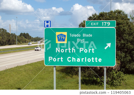 American freeway exit sign in Florida. I-75 highway junction with direction to North Port and Port Charlotte American freeway exit sign in Florida. I-75 highway junction with direction to North Port and Port Charlotte 119405063
