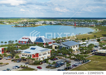 Autonomous town in Florida with photovoltaic rooftops covered with solar panels for producing of clean ecological electrical energy in downtown center Autonomous town in Florida with photovoltaic rooftops covered with solar panels for producing of clean ecological electrical energy in downtown center 119405074