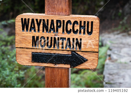 Closeup of wooden pointing sign to Waynapicchu mountain 119405192