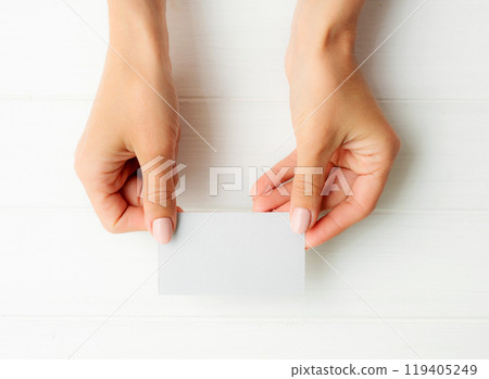 White business card in girl hands 119405249