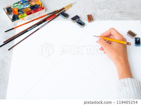 Top view of girl' hands drawing 119405254