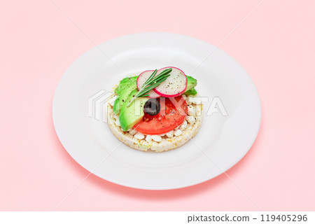Rice Cake Sandwich with Avocado, Tomato, Cottage Cheese, Olives and Radish 119405296