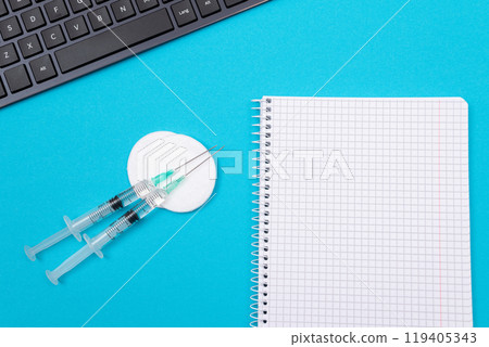 Vaccination or Revaccination Concept - Three Insulin Syringe on Blue Table Vaccination or Revaccination Concept - Three Insulin Syringe on Blue Table 119405343