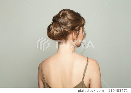 Elegant updo hairstyle, female back 119405471