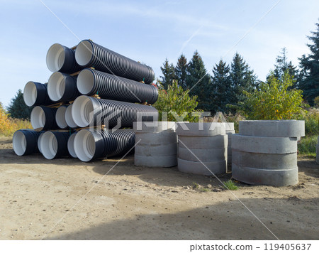 Large drainage pipes and concrete rings at construction site Large drainage pipes and concrete rings at construction site 119405637
