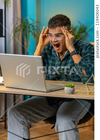 Frustrated business man having software problems with laptop error or mistake virus notification Frustrated business man having software problems with laptop error or mistake virus notification 119406043