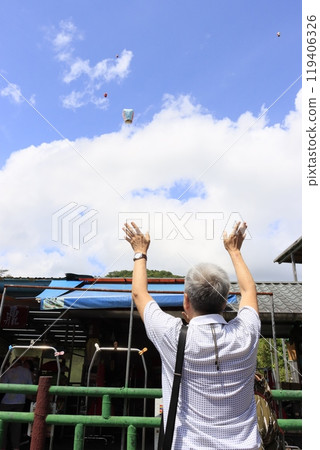 People seeing off lanterns at Shifen Station in Taiwan People seeing off lanterns at Shifen Station in Taiwan 119406326