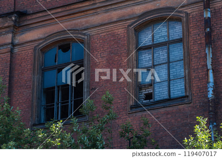 industrial background, windows of abandoned vintage factory building 119407017