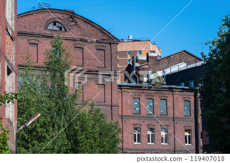 industrial background, vintage buildings of old factory workshops made of red brick 119407018