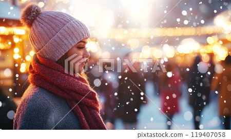 Young Woman Enjoying Snowfall at a Festive Winter Outdoor Market in Evening 119407058
