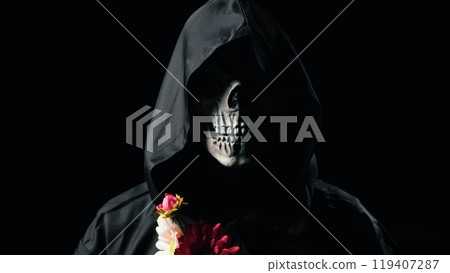 Dead man mask holding the flowers Dead man mask holding the flowers 119407287