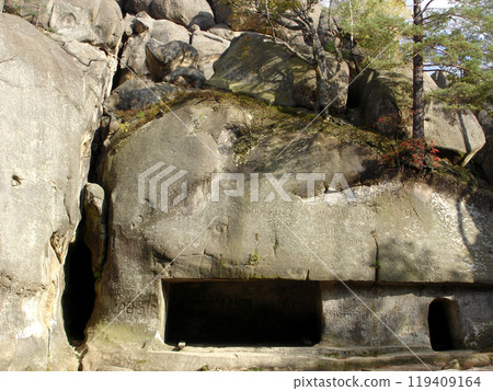 Rock man-made cave niche with tree red mountain ash on rock. Mountains Carpathians Rocks of Dovbush Rock man-made cave niche with tree red mountain ash on rock. Mountains Carpathians Rocks of Dovbush 119409164