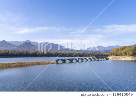 Taushubetsu River Bridge on the former Shihoro Line of the Japanese National Railways on a clear autumn day in Kamishihoro, Hokkaido 119410049