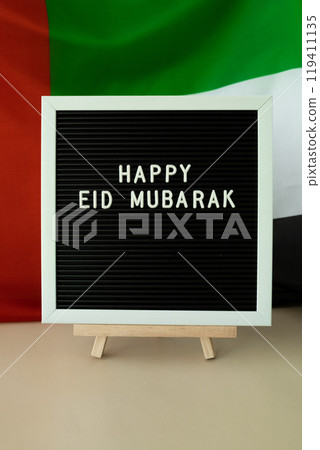 Message text HAPPY EID MUBARAK - happy holidays waving UAE flag on background concept. Greeting card advertisement. Commemoration Day Muslim Ramadan Blessed holy month public holiday Message text HAPPY EID MUBARAK - happy holidays waving UAE flag on background concept. Greeting card advertisement. Commemoration Day Muslim Ramadan Blessed holy month public holiday 119411135