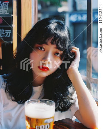 Asian woman drinking beer 119412244