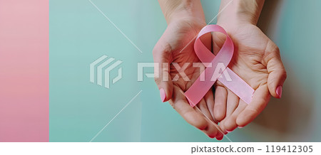 Hands holding pink ribbon 119412305