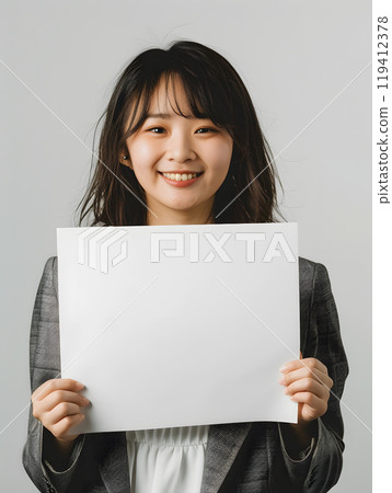Asian woman holding a whiteboard 119412378