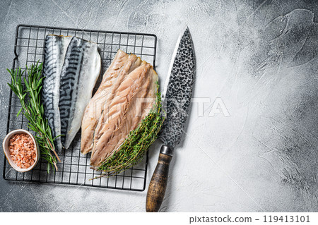 Fresh sliced mackerel fillet fish. White background. Top view. Copy space Fresh sliced mackerel fillet fish. White background. Top view. Copy space 119413101
