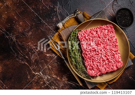 Fresh mutton lamb Mince Meat, raw ground meat. Dark background. Top view. Space for text Fresh mutton lamb Mince Meat, raw ground meat. Dark background. Top view. Space for text 119413107