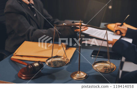 Judge gavel with Justice lawyers having team meeting at law firm background. Concepts of Law and Legal services. Judge gavel with Justice lawyers having team meeting at law firm background. Concepts of Law and Legal services. 119414058