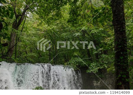 A waterfall with a spectacular flow caused by heavy rain 119414099