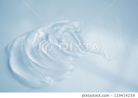 Liquid gel cosmetic texture on light blue background Liquid gel cosmetic texture on light blue background 119414259