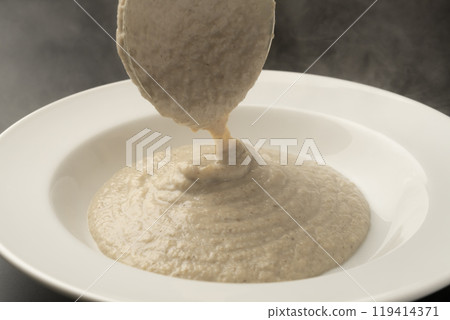 Mushroom potage: Ladle the potage onto a plate 119414371