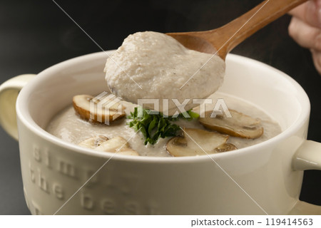 Mushroom potage - Pick up the mushroom potage soup with a spoon 119414563