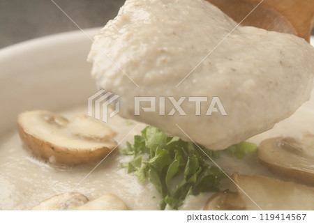 Mushroom potage - Pick up the mushroom potage soup with a spoon Mushroom potage - Pick up the mushroom potage soup with a spoon 119414567