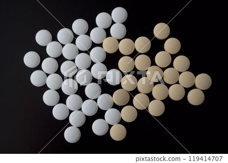 Pills on a black background 119414707