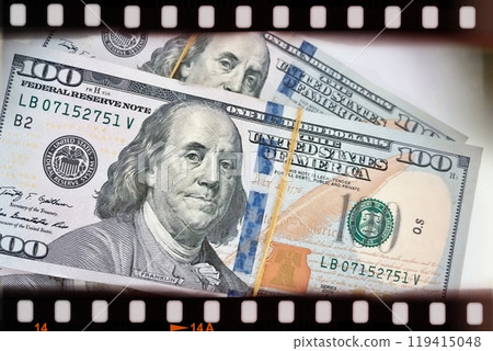 A Fan of $100 Bills.A close-up photo of a fan of $100 US dollar bills. The bills are arranged neatly, with the portrait of Benjamin Franklin visible on each bill. A Fan of $100 Bills.A close-up photo of a fan of $100 US dollar bills. The bills are arranged neatly, with the portrait of Benjamin Franklin visible on each bill. 119415048