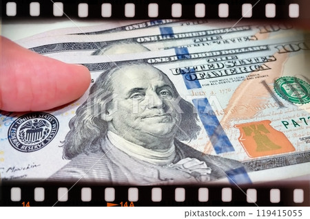 A Fan of $100 Bills.A close-up photo of a fan of $100 US dollar bills. The bills are arranged neatly, with the portrait of Benjamin Franklin visible on each bill.  119415055