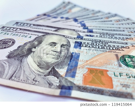 A Fan of $100 Bills.A close-up photo of a fan of $100 US dollar bills. The bills are arranged neatly, with the portrait of Benjamin Franklin visible on each bill. A Fan of $100 Bills.A close-up photo of a fan of $100 US dollar bills. The bills are arranged neatly, with the portrait of Benjamin Franklin visible on each bill. 119415064